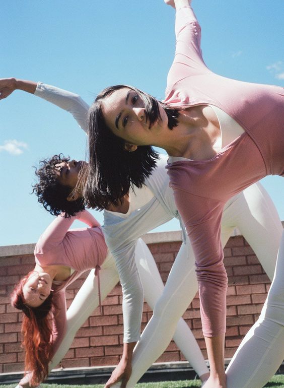 three girls doing yoga poses