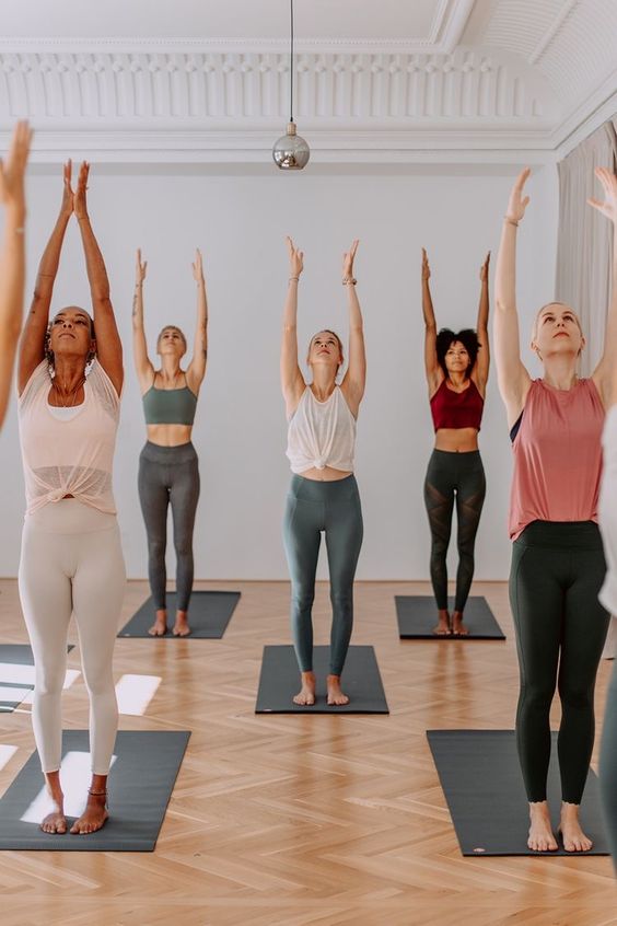 yoga class with ladies doing a sun rising