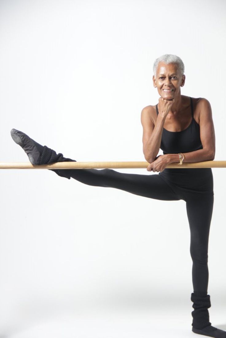 older woman doing ballet stretch 